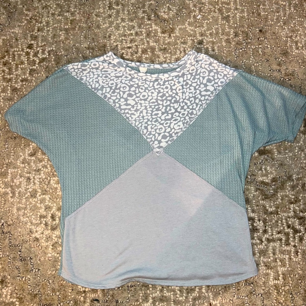 Boutique top. Has one small pick in fabric. Like new condition.